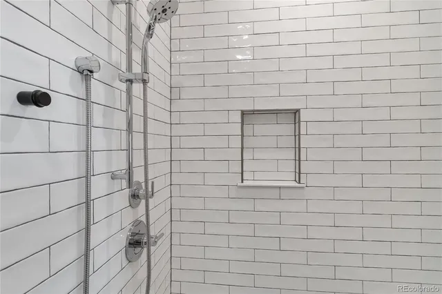 a bathroom with a double vanity sink a toilet and a mirror