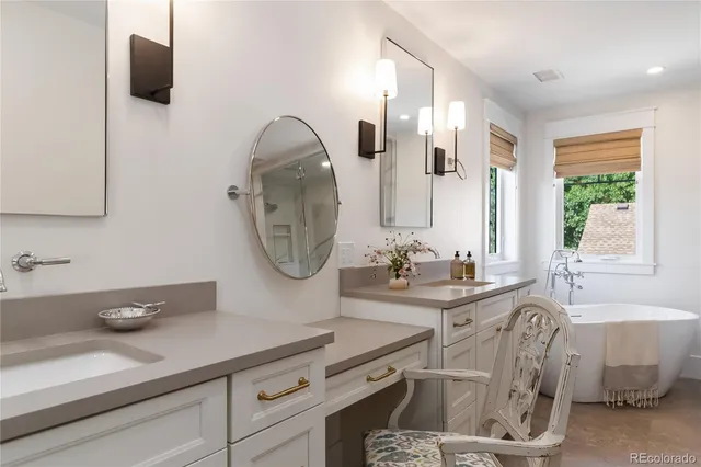 a bath room with a bathtub and a shower
