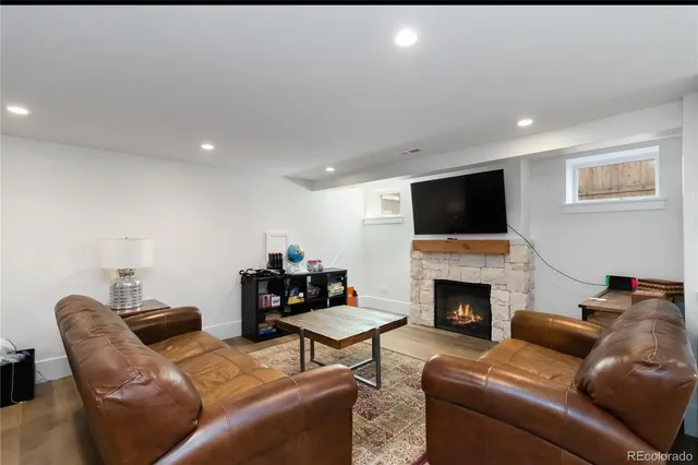 a kitchen with white cabinets and sink