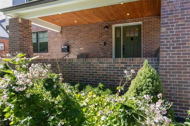 a view of brick house with a street