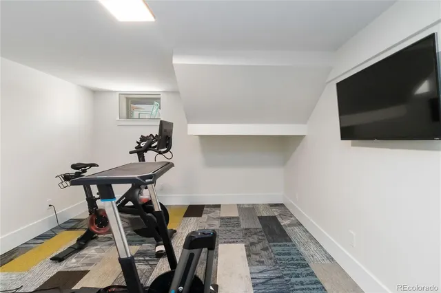 a bedroom with a bed and a table