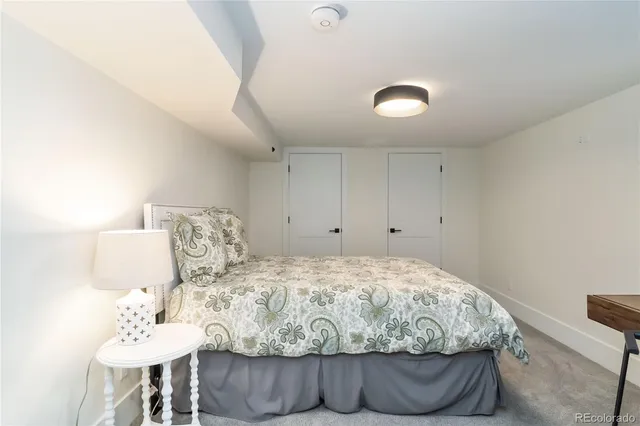 a living room with furniture and stairs