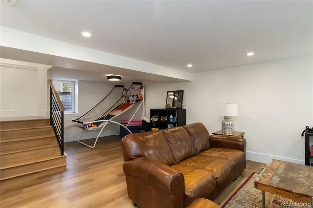 a living room with a fireplace and a television