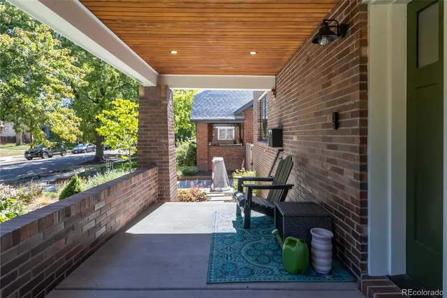 a patio with table and chairs