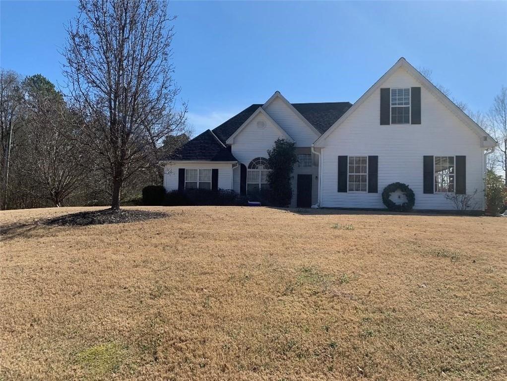 front view of a house with a yard