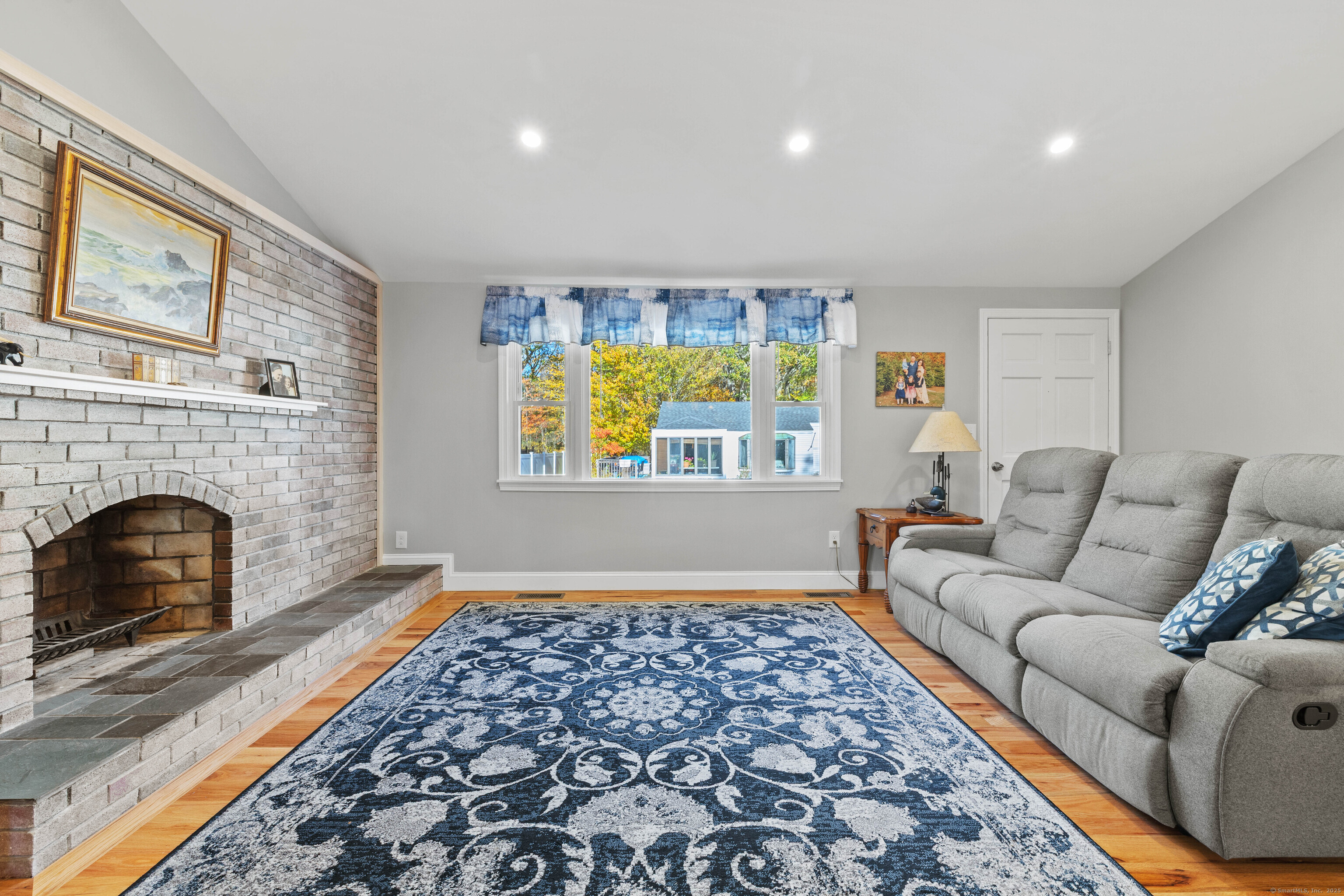 48 Billow Road East Lyme, CT 06357 - Photo 11 of 40 a living room with furniture and a fireplace