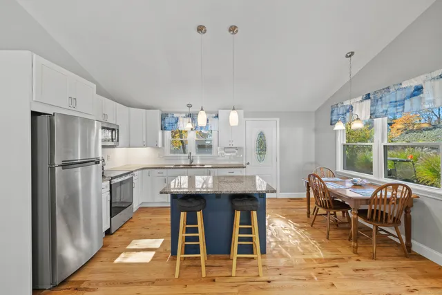 a kitchen with cabinets and window
