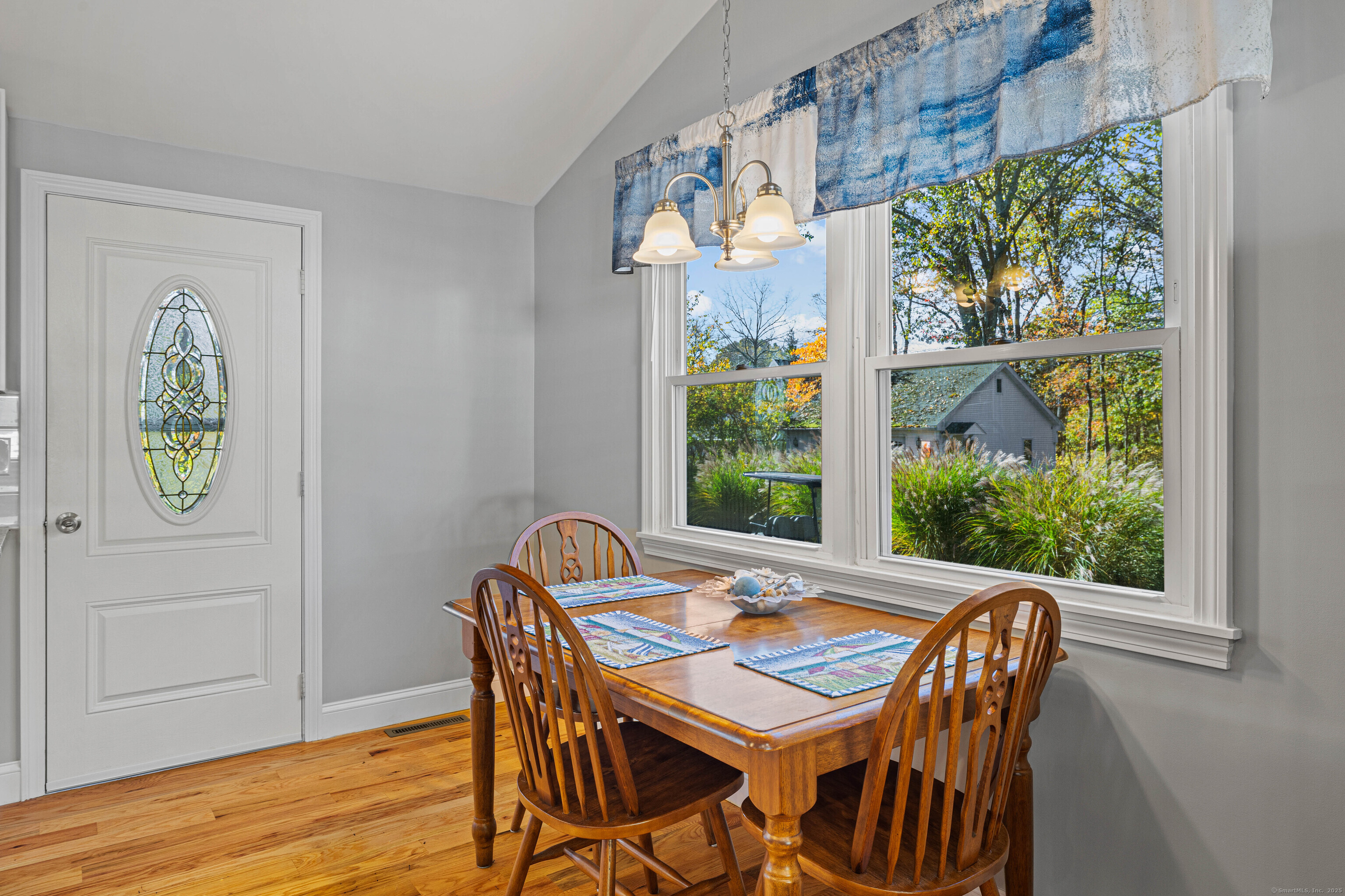 48 Billow Road East Lyme, CT 06357 - Photo 19 of 40 a view of a dining room with furniture window and wooden floor