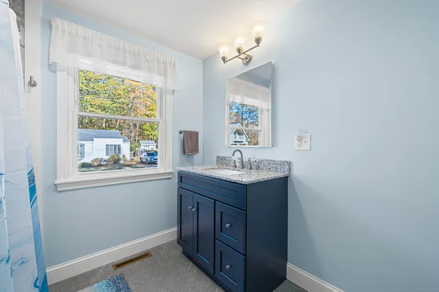 a bathroom with a shower and a toilet