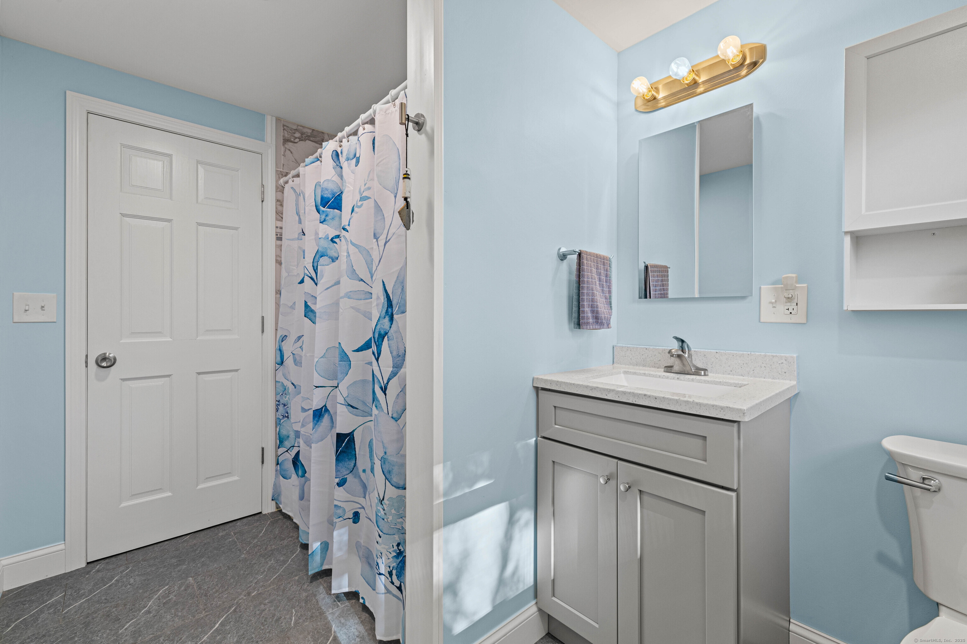 48 Billow Road East Lyme, CT 06357 - Photo 26 of 40 a bathroom with a sink a toilet and shower