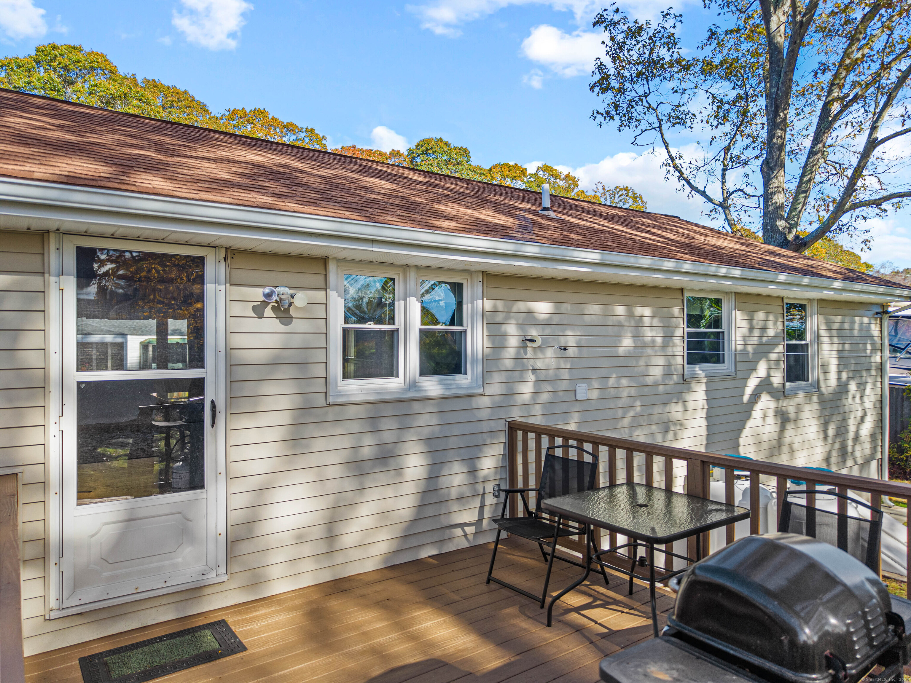48 Billow Road East Lyme, CT 06357 - Photo 31 of 40 a view of a chair and table in the balcony