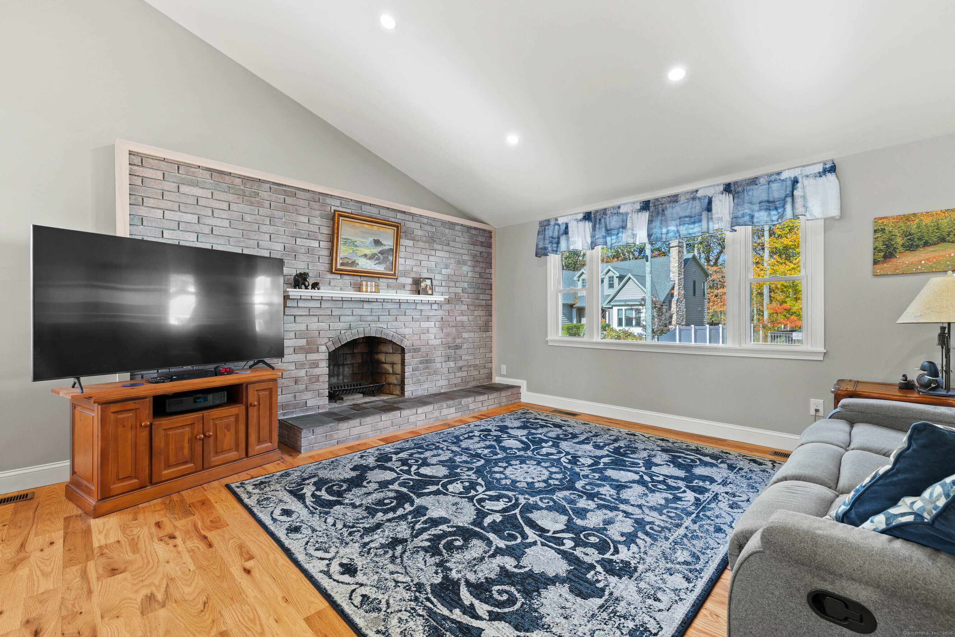 48 Billow Road East Lyme, CT 06357 - Photo 8 of 40 a living room with furniture and a flat screen tv