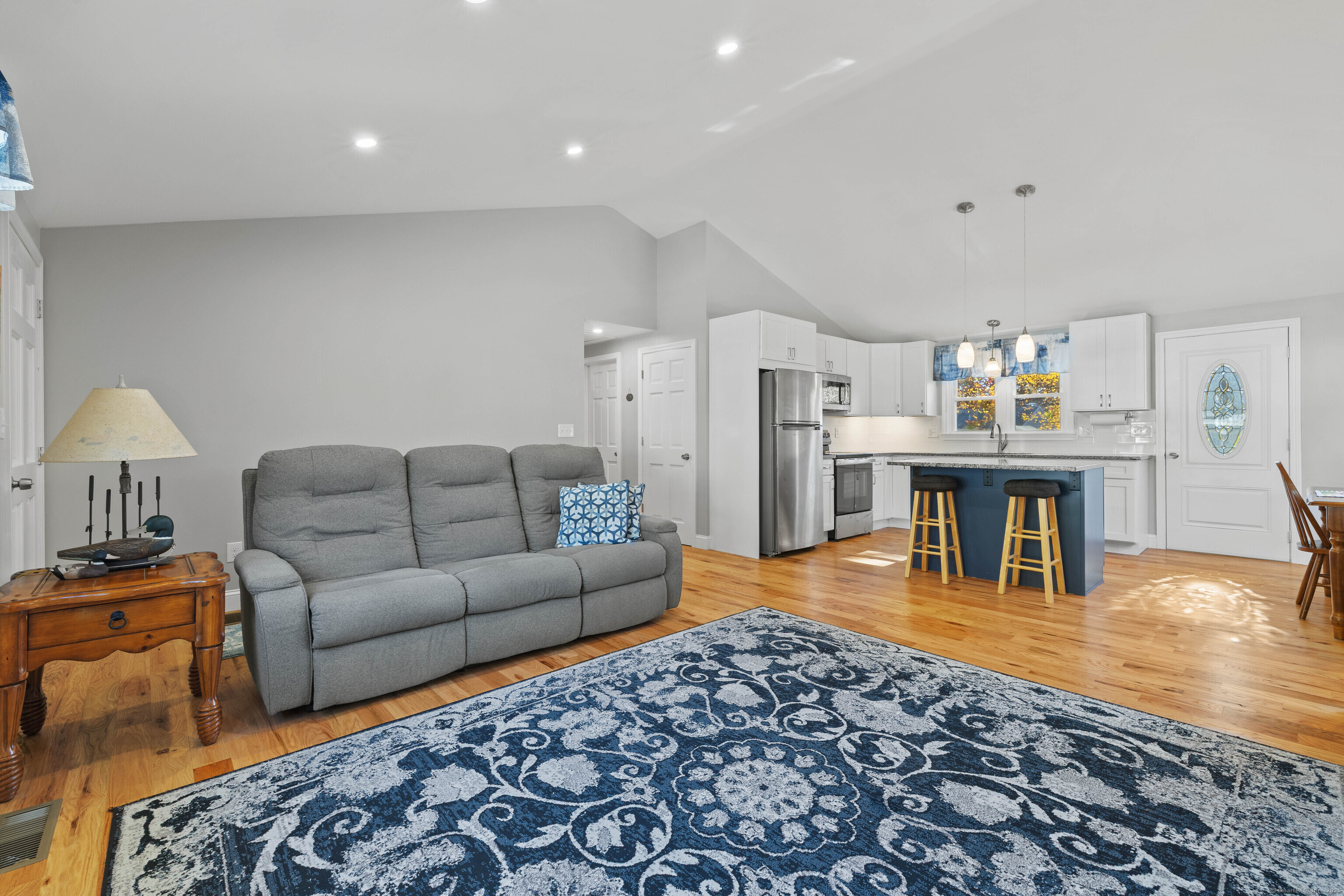 48 Billow Road East Lyme, CT 06357 - Photo 10 of 40 a living room with furniture and a wooden floor