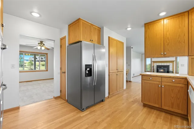 a kitchen with stainless steel appliances a refrigerator sink and cabinets