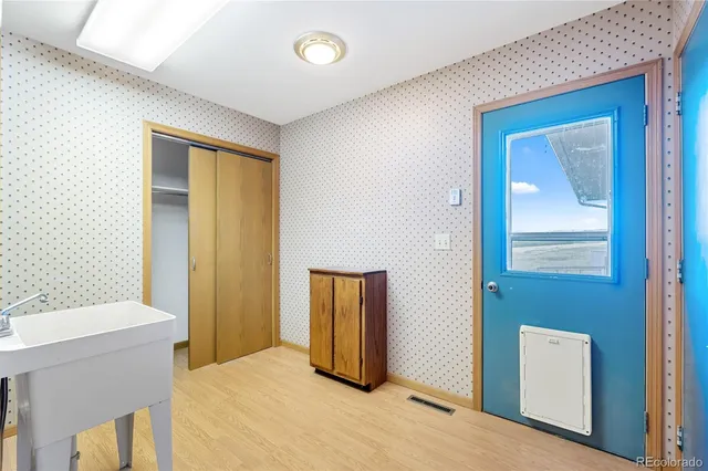 a bedroom with a bed and a mirror