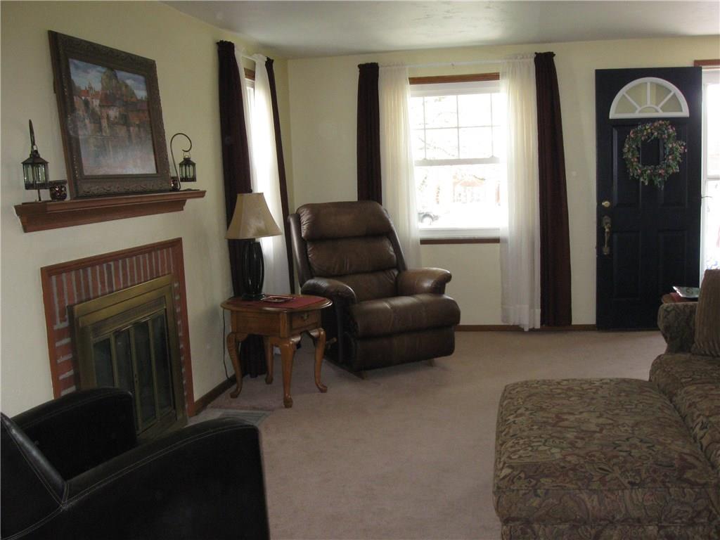 2040 Spring Valley Road Pittsburgh, PA 15243 - Photo 2 of 23 a living room with furniture and a fireplace