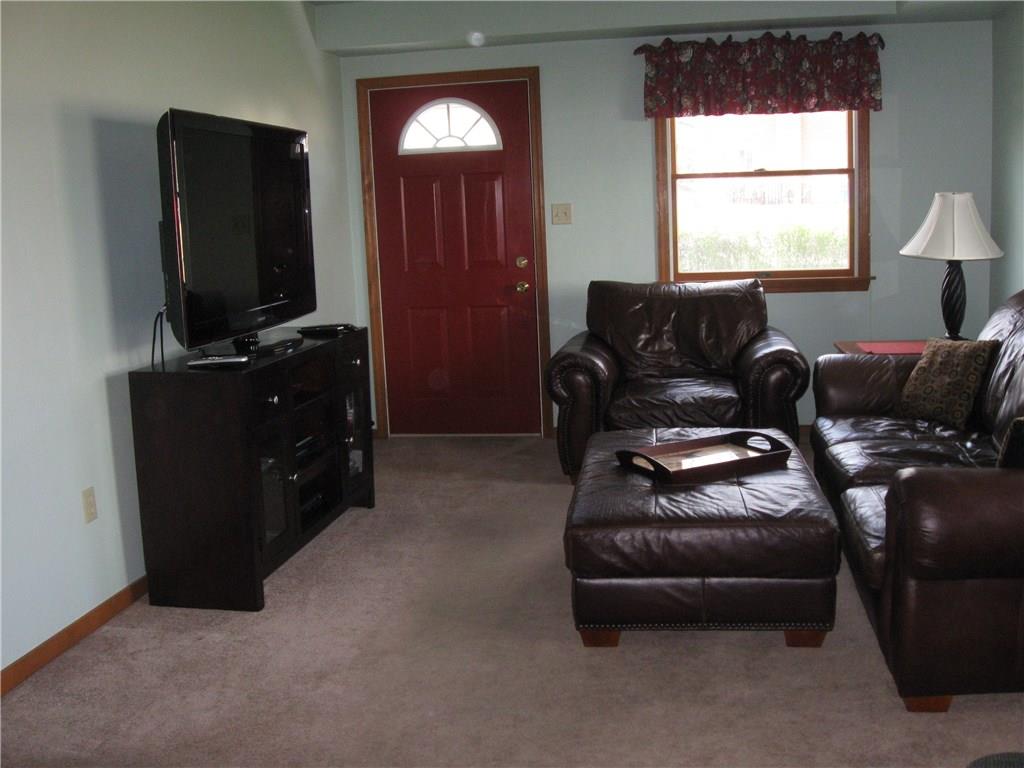 2040 Spring Valley Road Pittsburgh, PA 15243 - Photo 6 of 23 a living room with furniture and a flat screen tv