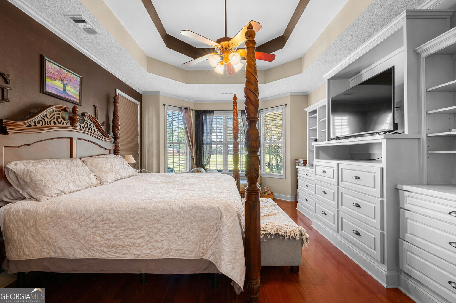 21 Hunters Overlook Drive Senoia, GA 30276 - Photo 16 of 37 a bedroom with a large bed and a flat tv screen on dresser