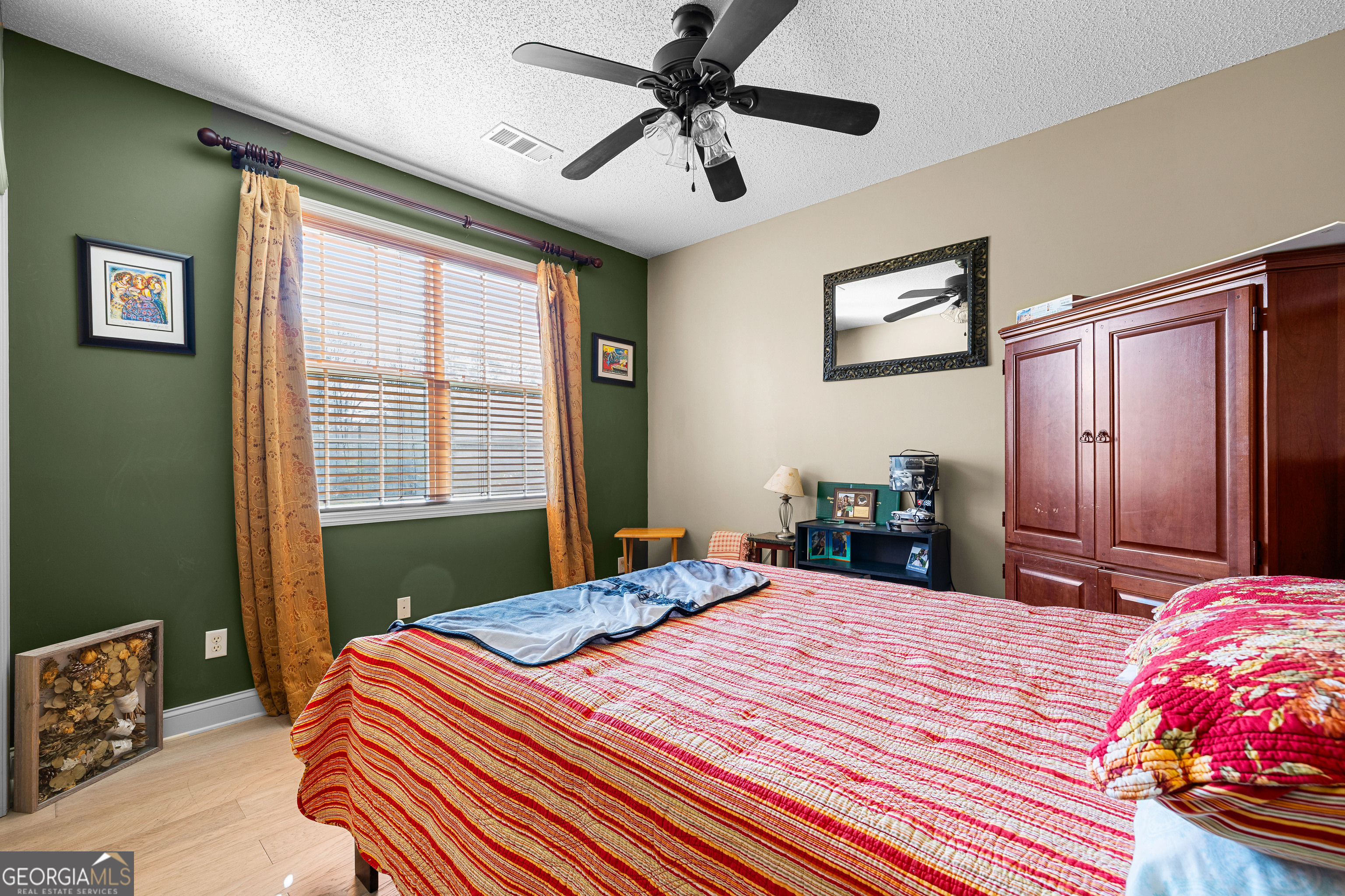 21 Hunters Overlook Drive Senoia, GA 30276 - Photo 23 of 37 a bedroom with a bed dresser and a window