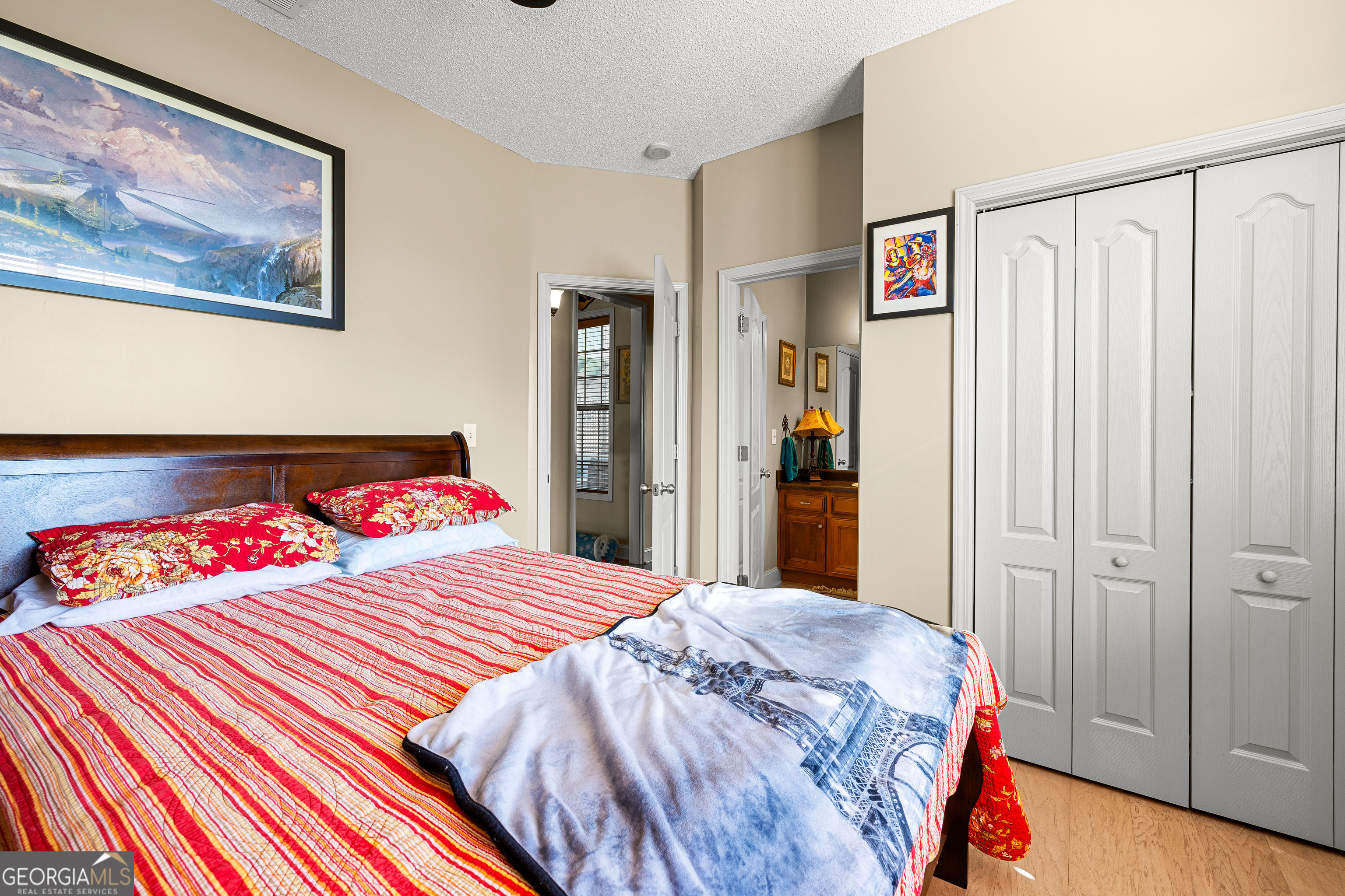 21 Hunters Overlook Drive Senoia, GA 30276 - Photo 24 of 37 a bedroom with a bed and a painting on the wall