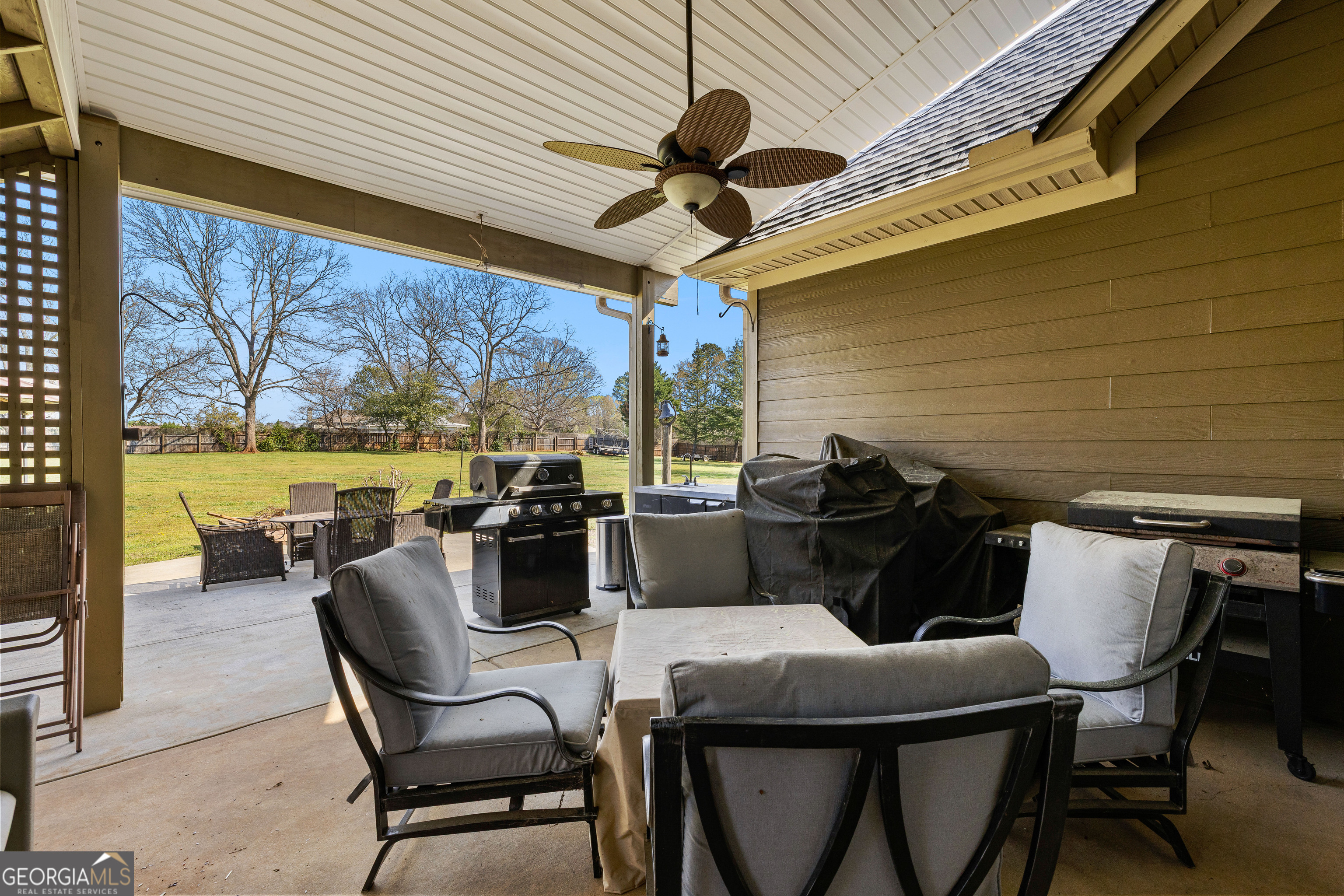 21 Hunters Overlook Drive Senoia, GA 30276 - Photo 30 of 37 a dining room with furniture and a floor to ceiling window