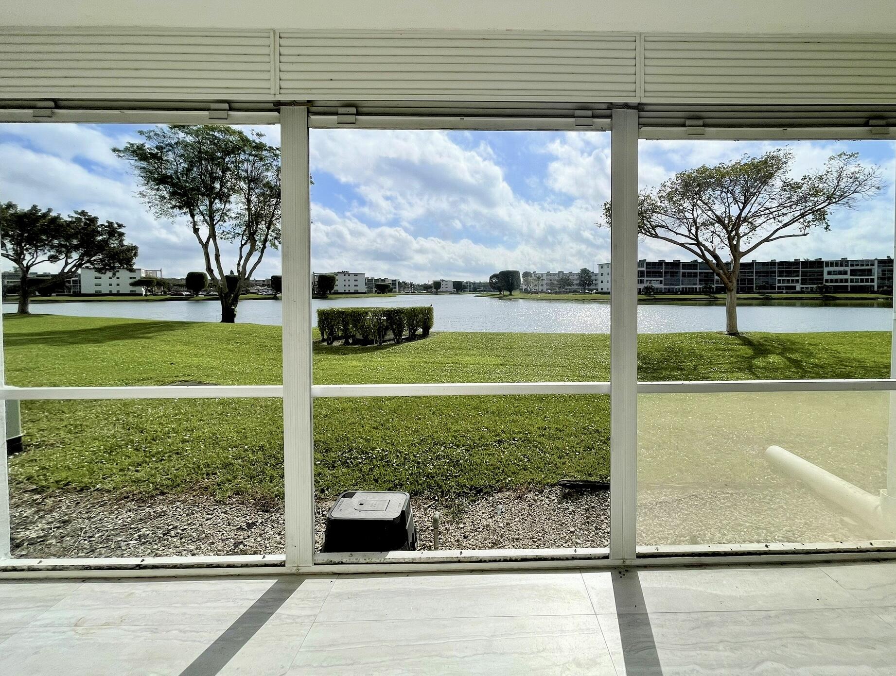 1030 Rexford B Boca Raton, FL 33434 - Photo 24 of 27 a view of a back yard from a window