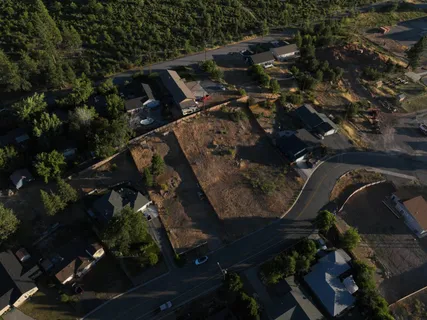 an aerial view of house with yard