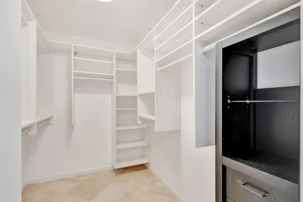 a view of storage and utility room with washer and dryer