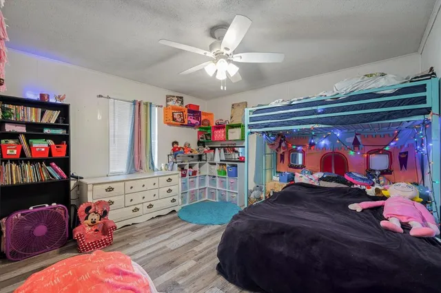 a bed room with a bed and a window