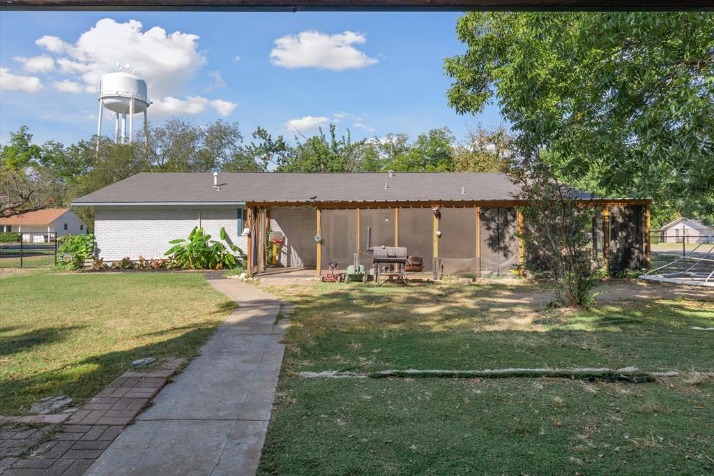 503 South Houston Street Edgewood, TX 75117 - Photo 24 of 31 a view of a house with a yard