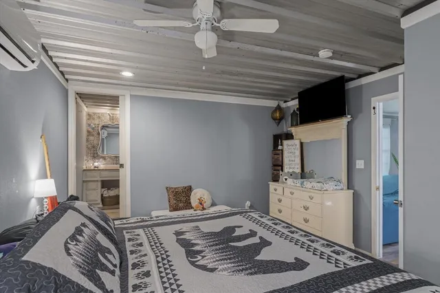 a living room with hard wood flooring and furniture