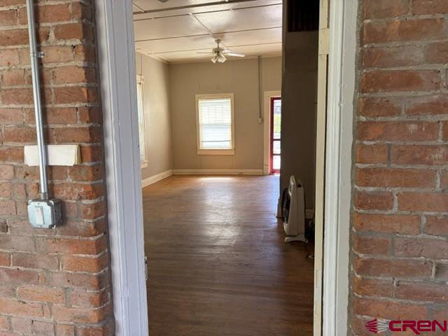 116 South Mary Street Ridgway, CO 81432 - Photo 10 of 23 a view of a hallway with wooden floor and a bathroom