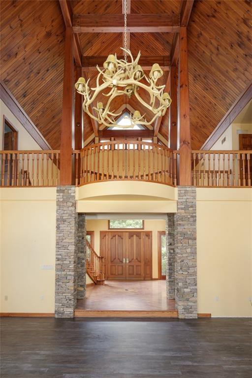 105 Serena Road Ligonier, PA 15658 - Photo 7 of 42 A second antler chandelier in the living room ... note the warm wood ceiling