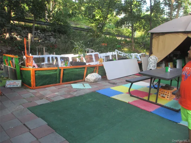 a view of a chairs and table in the garden