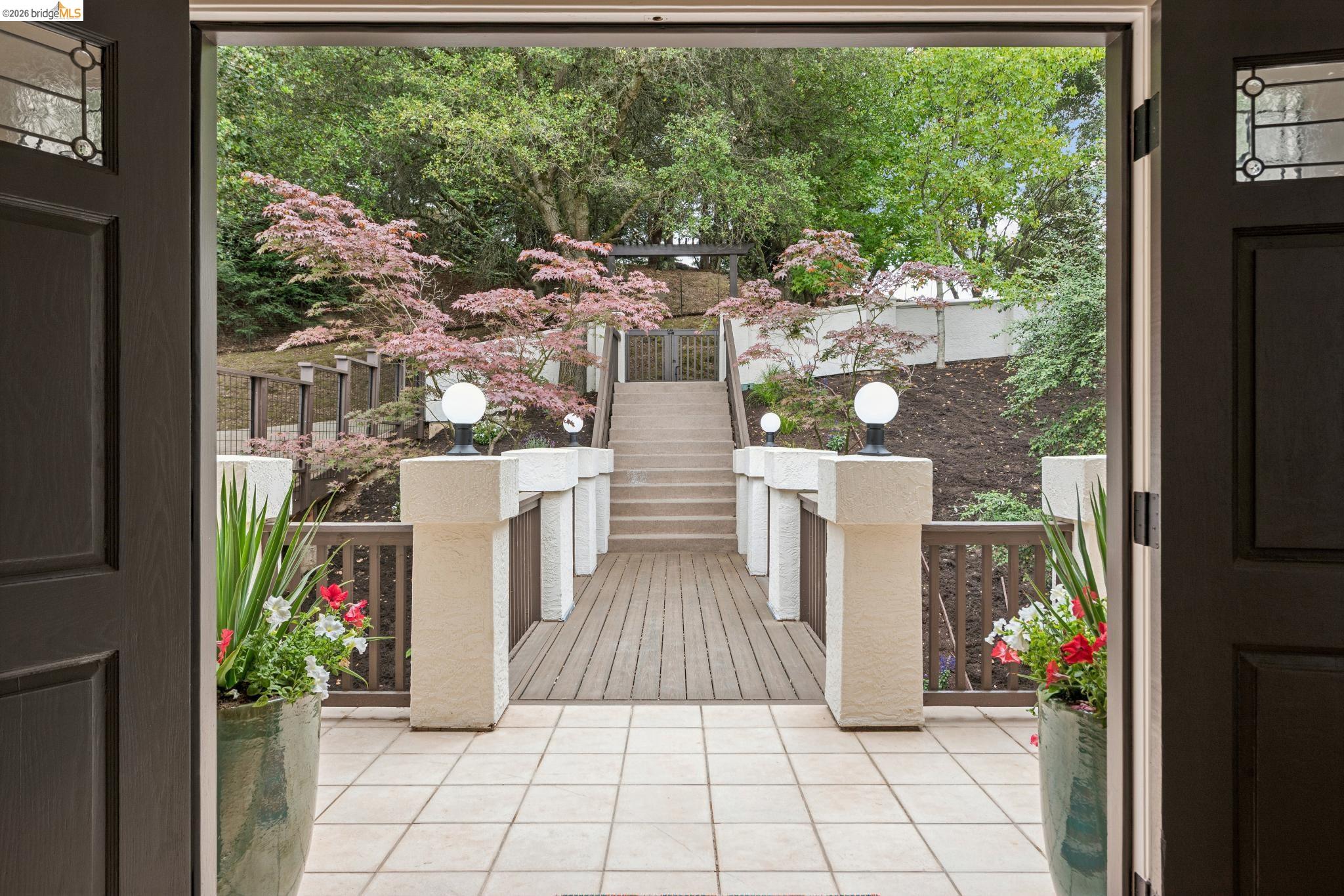 1325 Drury Road Berkeley, CA 94705 - Photo 10 of 71 Tiled patio entry with dark wood doors featuring decorative glass panels