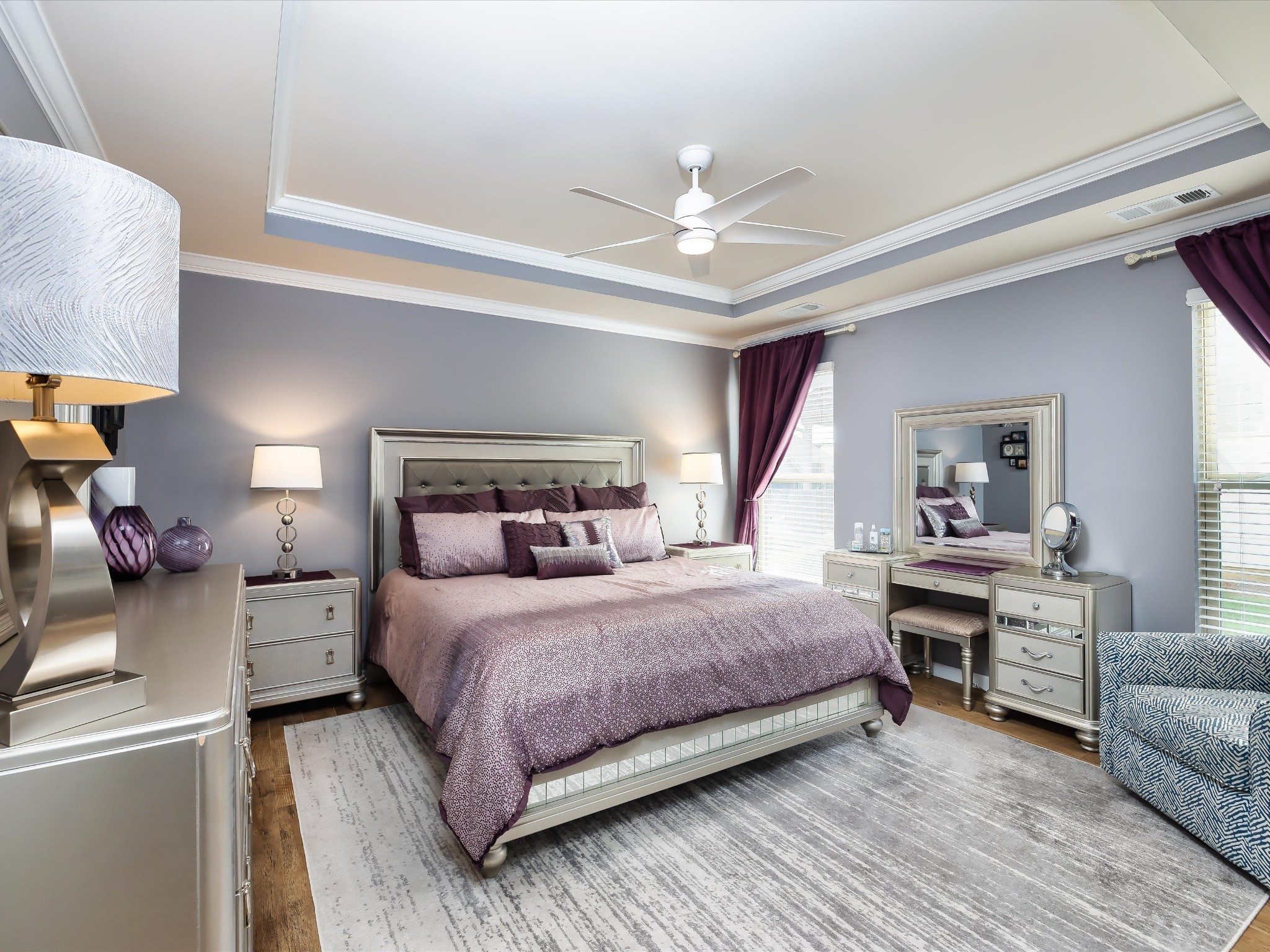 141 Tipton Pass Spring Hill, TN 37174 - Photo 16 of 49 a bedroom with a bed and a chandelier