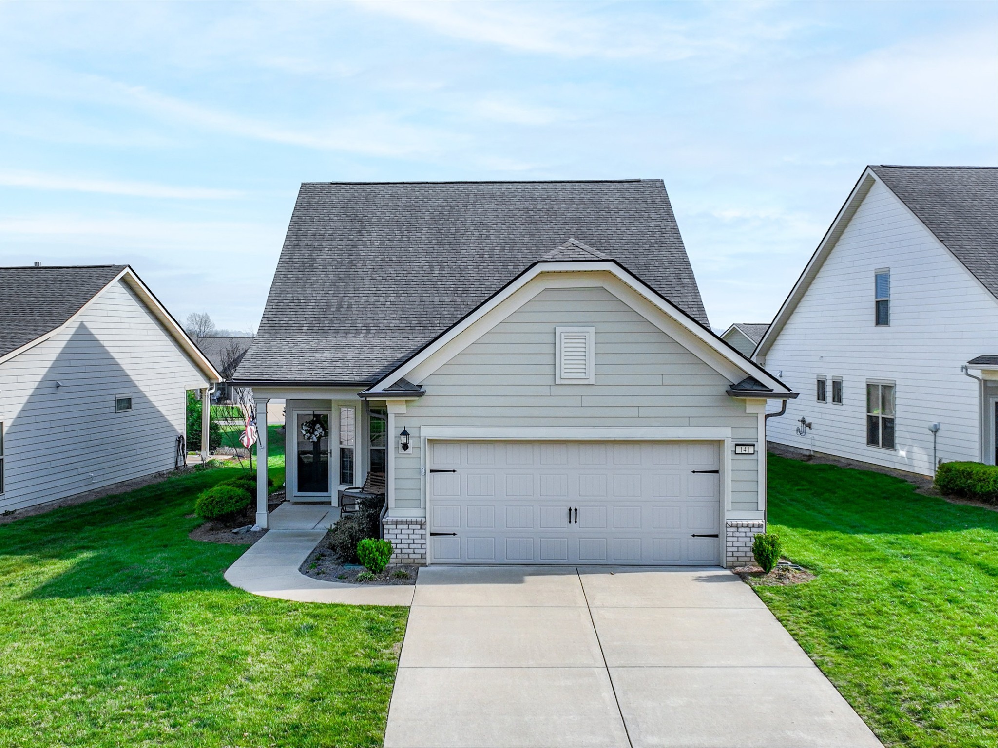 141 Tipton Pass Spring Hill, TN 37174 - Photo 2 of 49 a front view of house with a garden