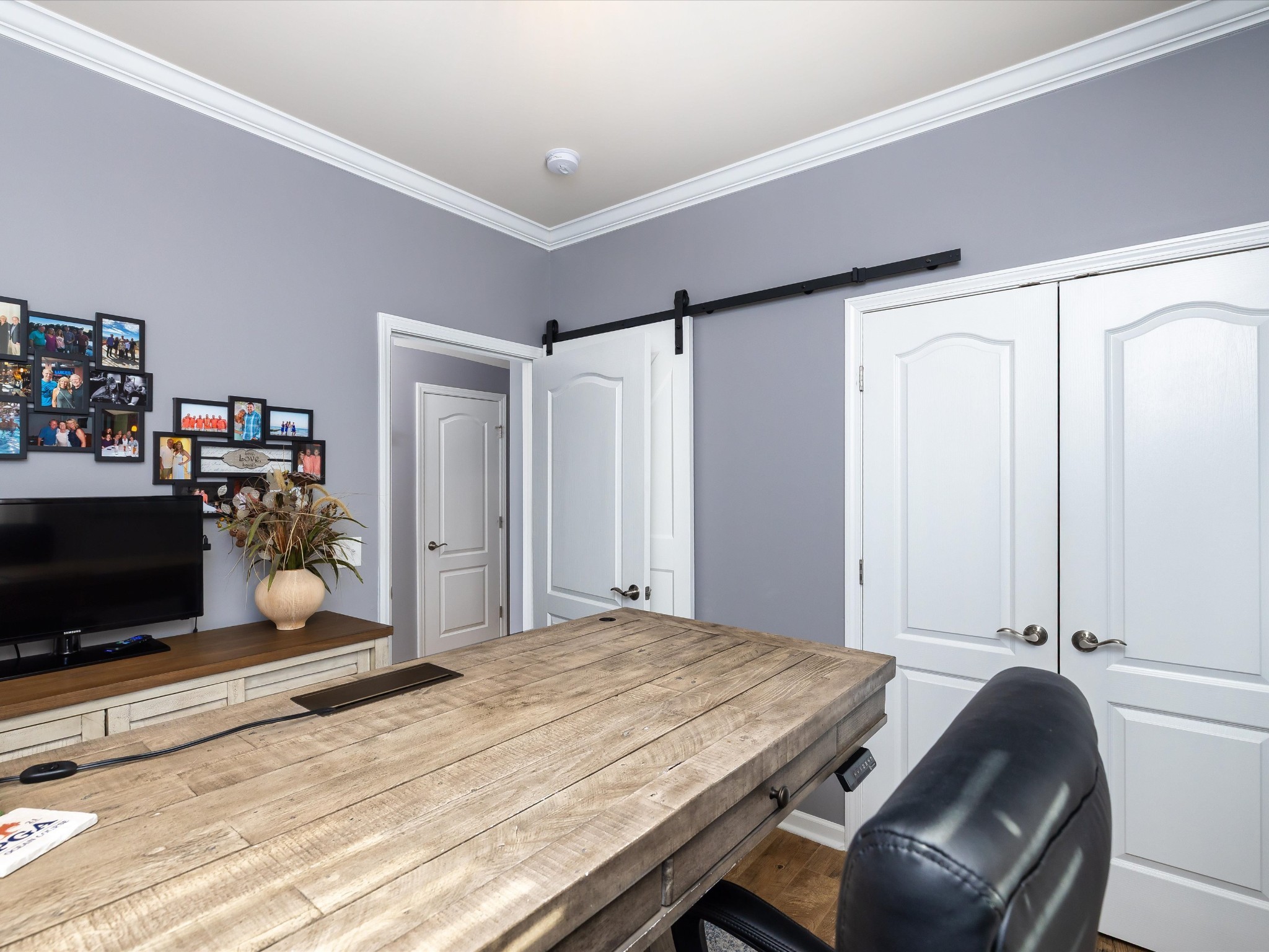 141 Tipton Pass Spring Hill, TN 37174 - Photo 23 of 49 a bedroom with a bed and a flat screen tv