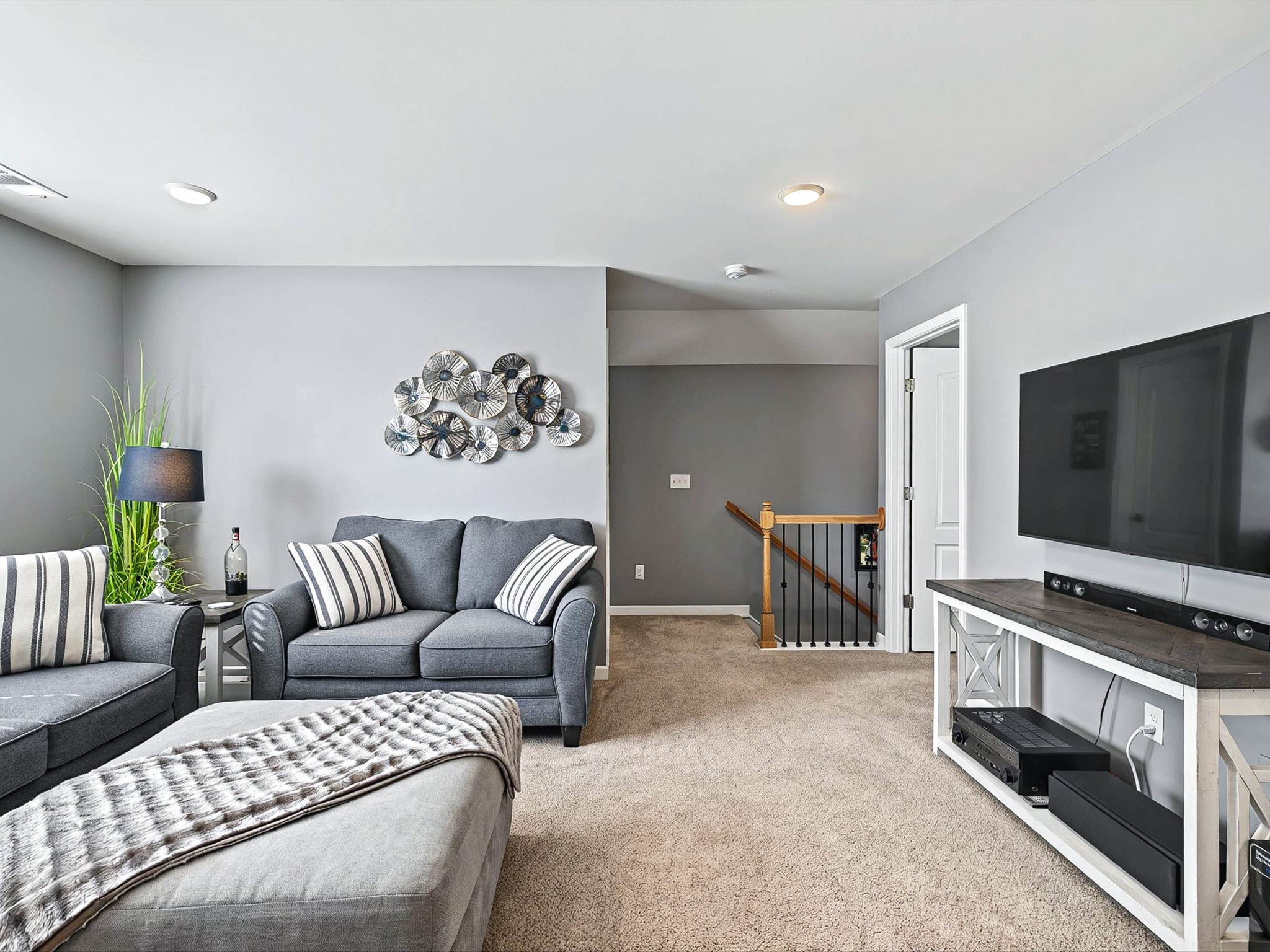 141 Tipton Pass Spring Hill, TN 37174 - Photo 26 of 49 a living room with furniture and a flat screen tv