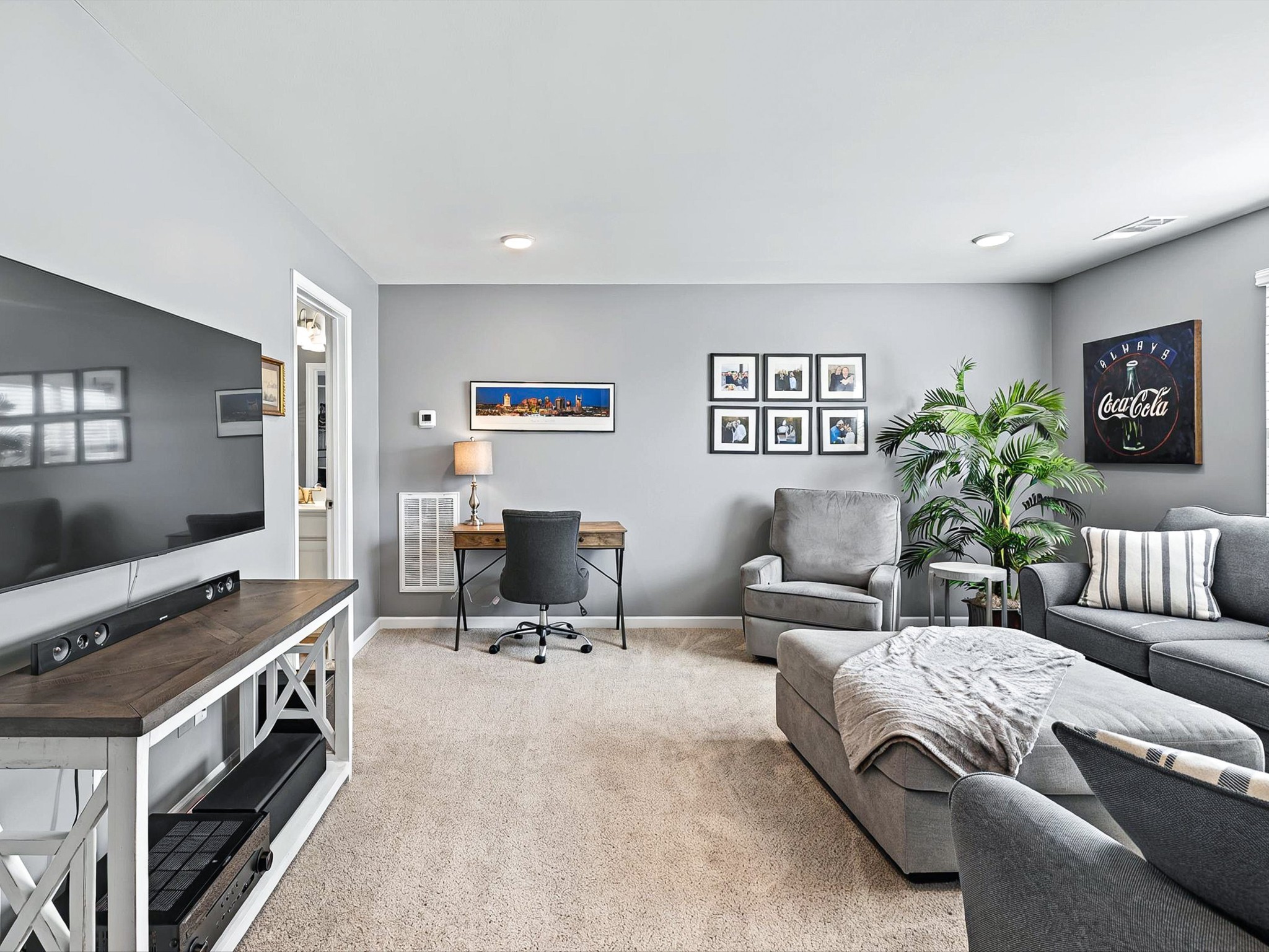 141 Tipton Pass Spring Hill, TN 37174 - Photo 27 of 49 a living room with furniture and a flat screen tv
