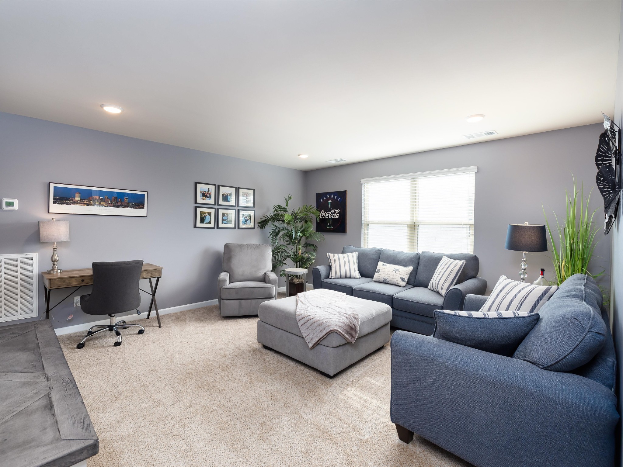141 Tipton Pass Spring Hill, TN 37174 - Photo 28 of 49 a living room with couches and a flat screen tv