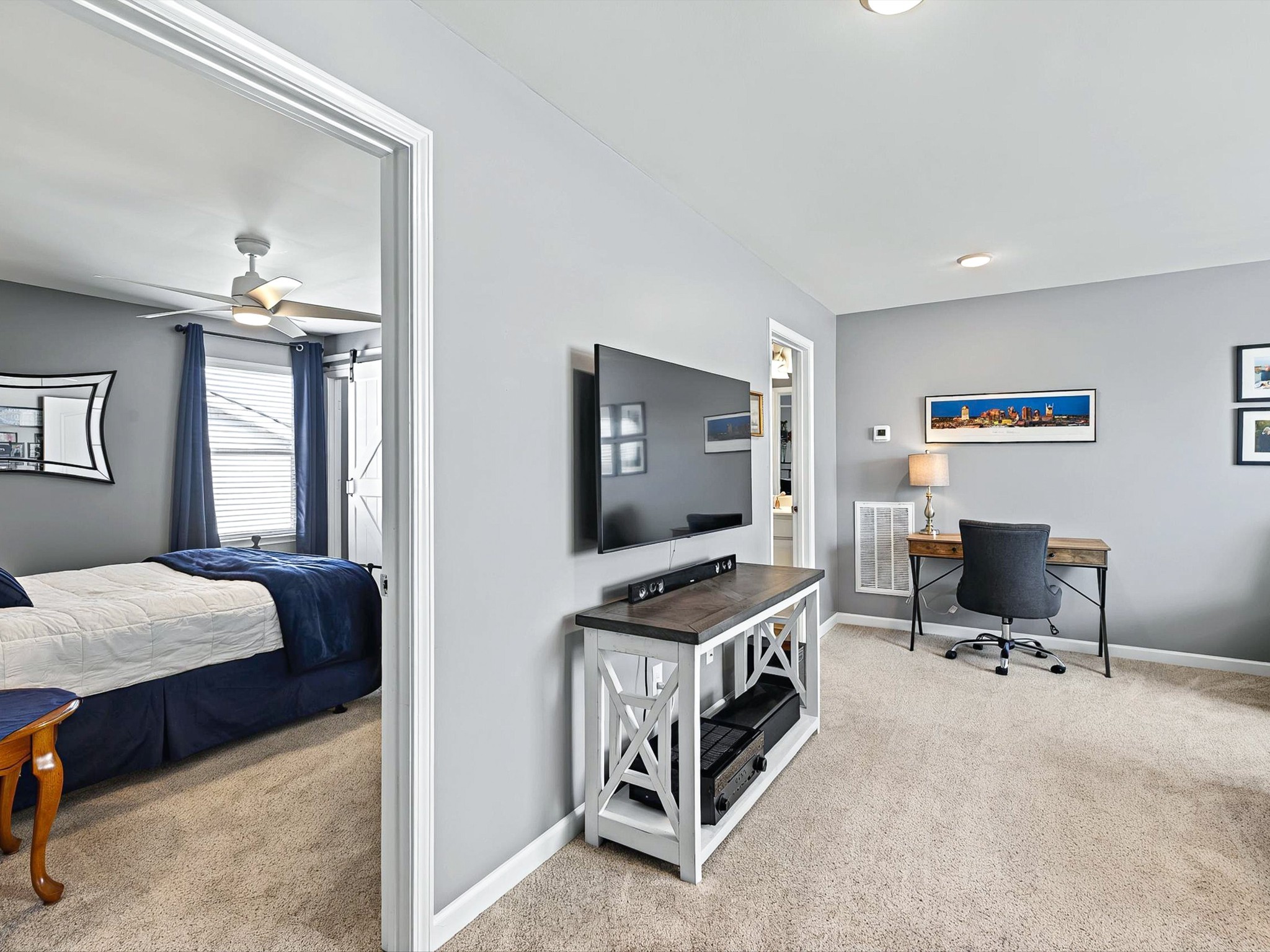 141 Tipton Pass Spring Hill, TN 37174 - Photo 29 of 49 a bedroom with furniture and a flat screen tv