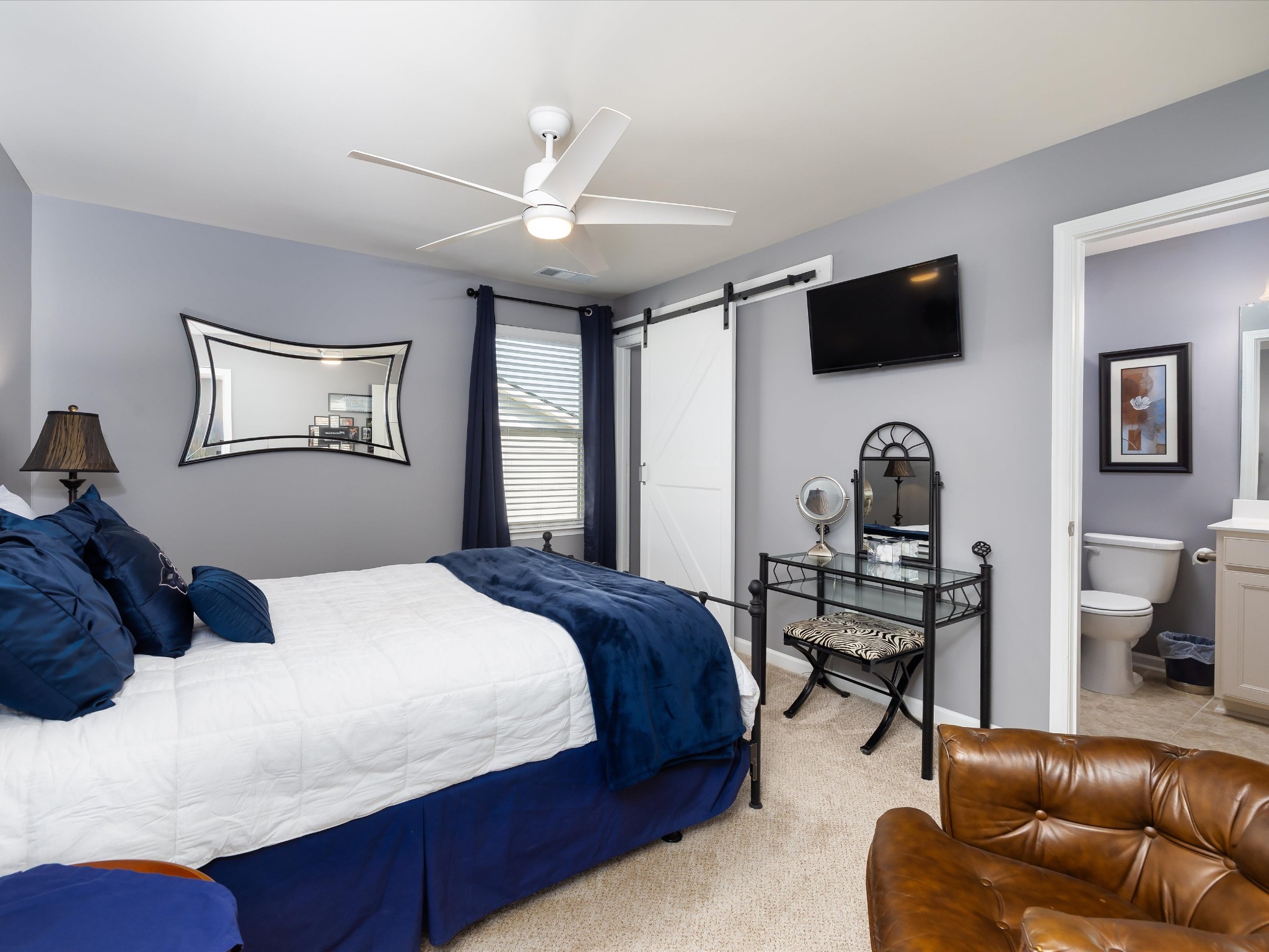 141 Tipton Pass Spring Hill, TN 37174 - Photo 30 of 49 a bedroom with a bed a couch and dresser