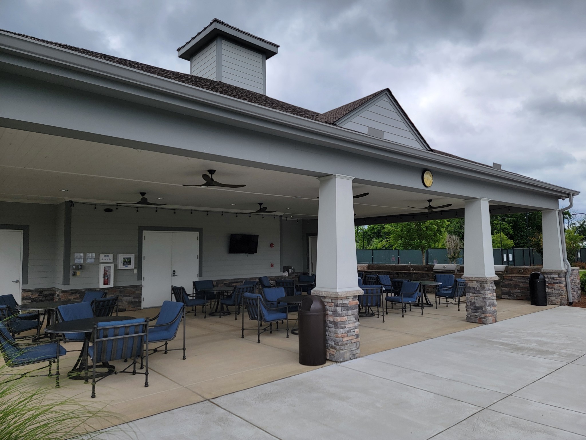 141 Tipton Pass Spring Hill, TN 37174 - Photo 44 of 49 a view of a patio with table and chairs and potted plants