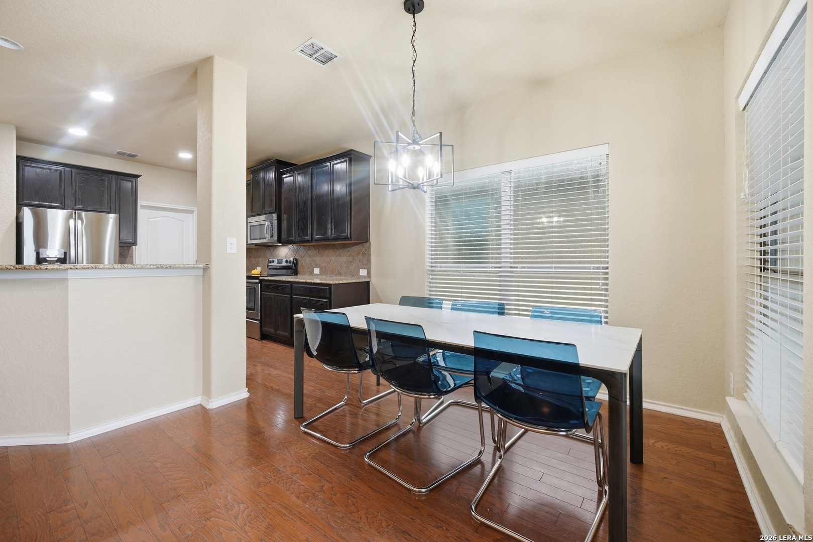 313 Brook Shadow Cibolo, TX 78108 - Photo 13 of 29 a view of a dining room with furniture and wooden floor