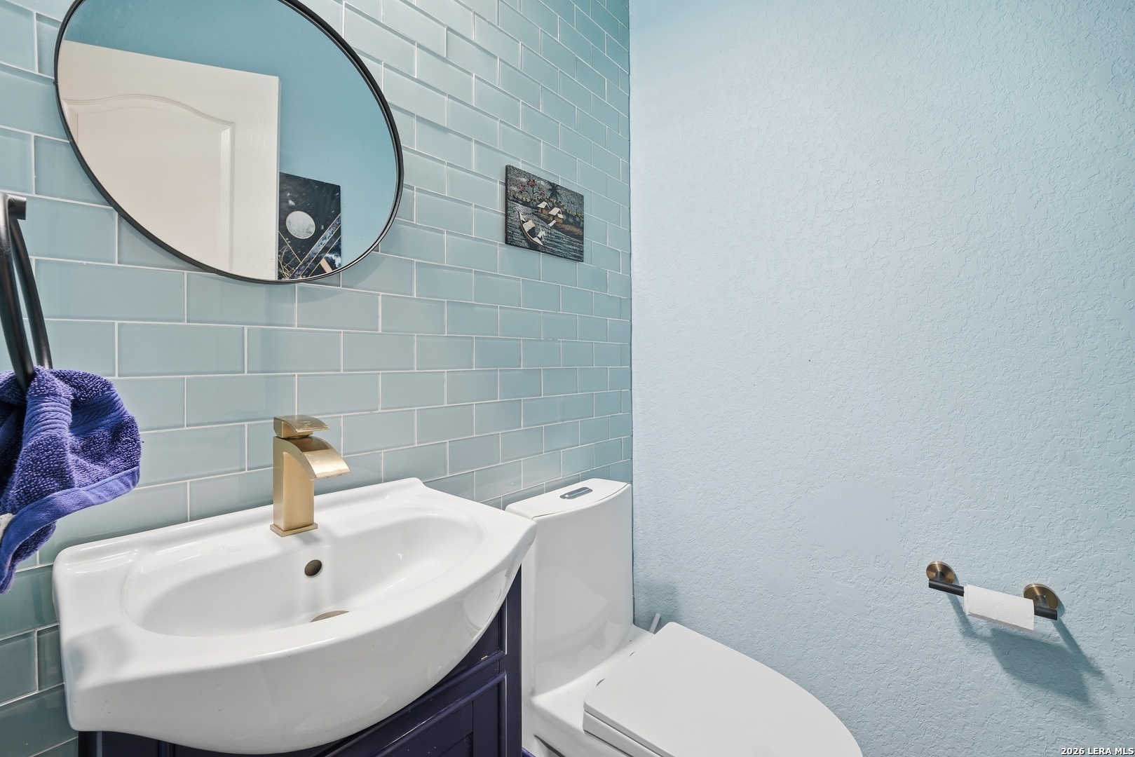 313 Brook Shadow Cibolo, TX 78108 - Photo 14 of 29 a bathroom with a sink a mirror and toilet