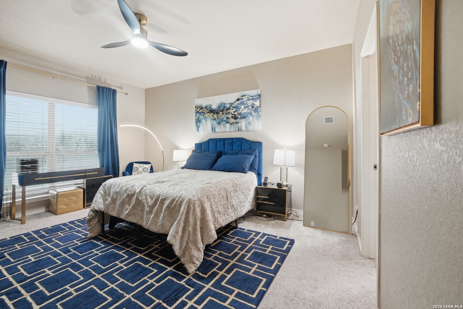 313 Brook Shadow Cibolo, TX 78108 - Photo 15 of 29 a bedroom with a bed and wooden floor