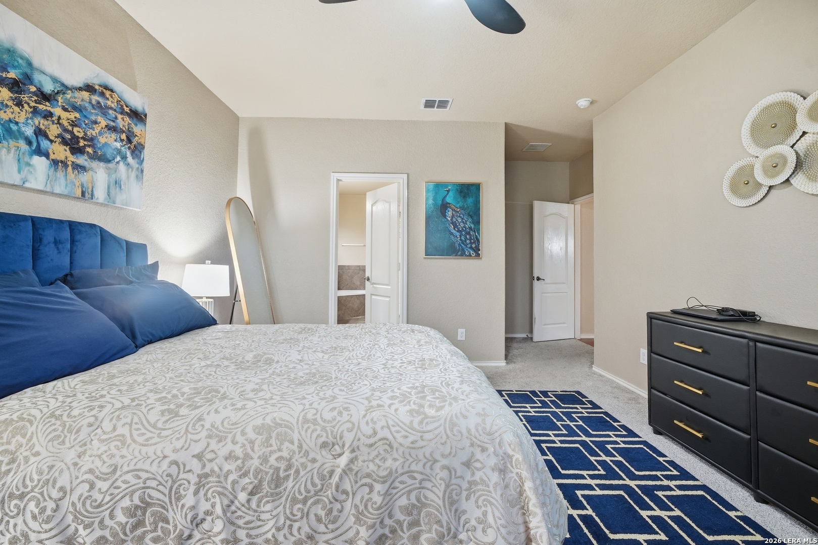 313 Brook Shadow Cibolo, TX 78108 - Photo 16 of 29 a bedroom with a bed and a mirror on the dresser