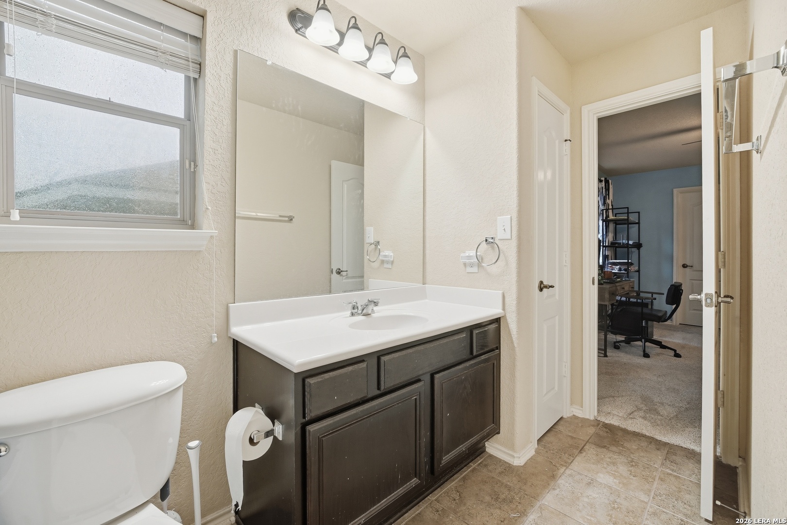 313 Brook Shadow Cibolo, TX 78108 - Photo 20 of 29 a bathroom with a sink a toilet and shower