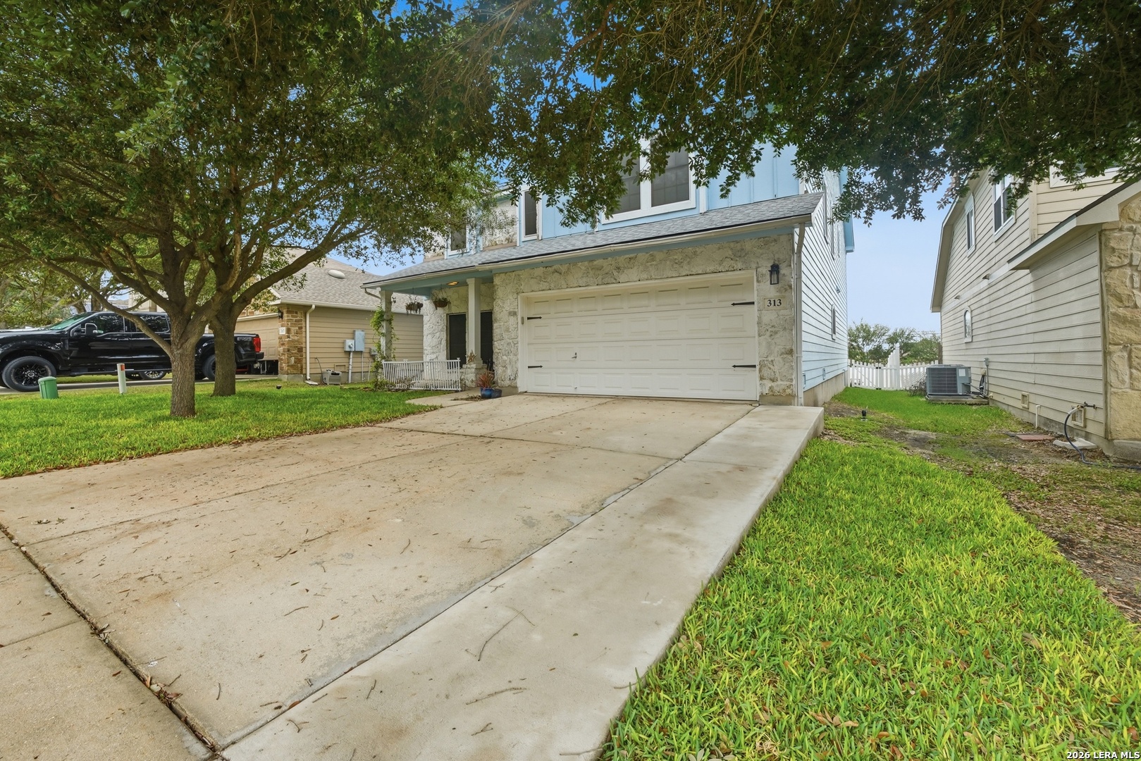313 Brook Shadow Cibolo, TX 78108 - Photo 2 of 29 a front view of a house with a yard and garage